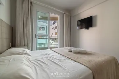 Uma cama ou camas num quarto em RFO - Apartamentos a poucos passos da Praia de Bombinhas