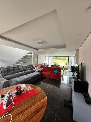 Uma área de estar em Beach House Delegado Marcio