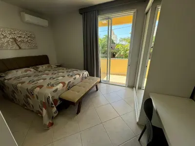 Uma cama ou camas num quarto em Cód 11 - Excelente casa localizada á 180m do mar