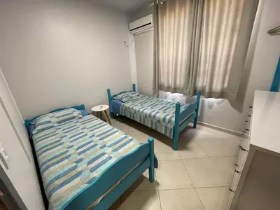 Uma cama ou camas num quarto em Cód 11 - Excelente casa localizada á 180m do mar