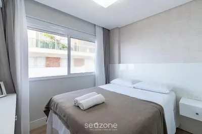 Uma cama ou camas num quarto em VDT - Apartamentos a 180m da Praia de Bombas