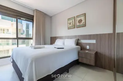 Uma cama ou camas num quarto em DRL - Apartamentos a 300m da Praia de Bombinhas