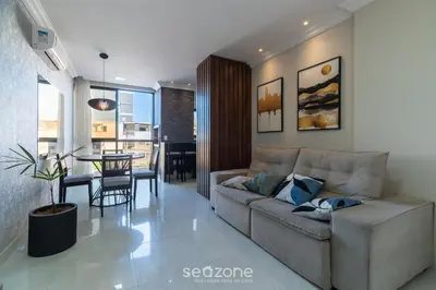 Uma área de estar em UML - Apartamentos quadra mar em Bombinhas