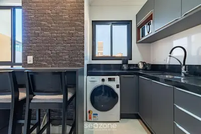 A cozinha ou kitchenette de UML - Apartamentos quadra mar em Bombinhas