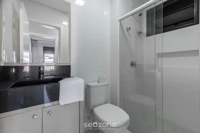 Uma casa de banho em UML - Apartamentos quadra mar em Bombinhas