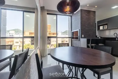 Uma área de estar em UML - Apartamentos quadra mar em Bombinhas