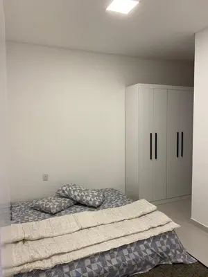 Uma cama ou camas num quarto em Lindo Sobrado em Camboriú
