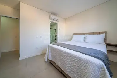 Uma cama ou camas num quarto em Apartamento com 2 quartos Bombinhas