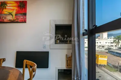 Uma televisão e/ou sistema de entretenimento em Apartamento com 2 quartos Bombinhas