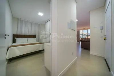 Uma cama ou camas num quarto em Apartamento com 2 quartos Bombinhas