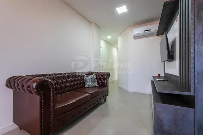Uma televisão e/ou sistema de entretenimento em Apartamento com 2 quartos Bombinhas
