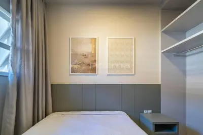 Uma cama ou camas num quarto em Apartamento 1 dormitório - 50 metros da Praia de Bombinhas