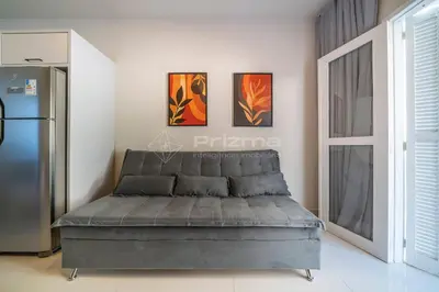 Uma área de estar em Apartamento 1 dormitório - 50 metros da Praia de Bombinhas