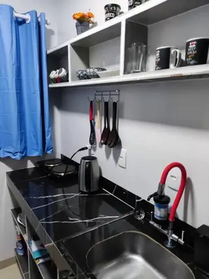 A cozinha ou kitchenette de Loft 1 com ar condicionado prox Praia Laranjeiras facil acesso pela BR101