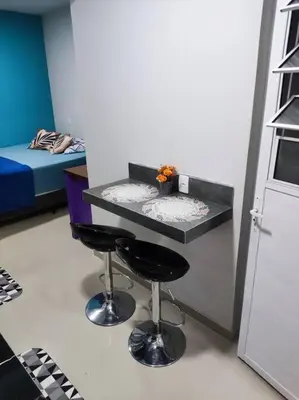 Uma cama ou camas num quarto em Loft 1 com ar condicionado prox Praia Laranjeiras facil acesso pela BR101