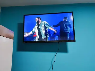 Uma televisão e/ou sistema de entretenimento em Loft 1 com ar condicionado prox Praia Laranjeiras facil acesso pela BR101