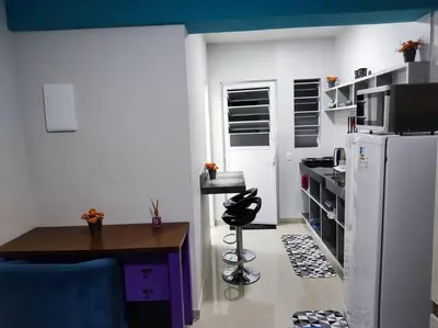 A cozinha ou kitchenette de Loft 1 com ar condicionado prox Praia Laranjeiras facil acesso pela BR101