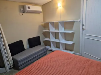 Uma cama ou camas num quarto em Duplex No 03 de 4 quartos frente ao mar