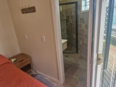 Uma casa de banho em Duplex No 03 de 4 quartos frente ao mar