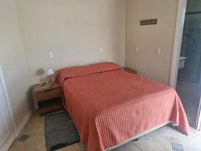 Uma cama ou camas num quarto em Duplex No 03 de 4 quartos frente ao mar