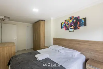 Uma cama ou camas num quarto em Apto 3Q c/ Churrasq. a 290m da Praia PIC0125