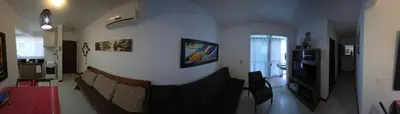 Uma televisão e/ou sistema de entretenimento em Apartamento - Praia de Palmas