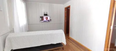 Uma cama ou camas num quarto em Chalé na praia