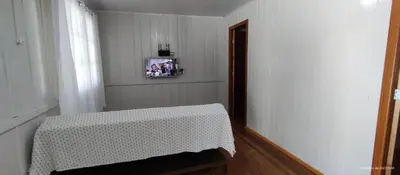 Uma cama ou camas num quarto em Chalé na praia