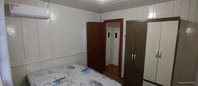 Uma cama ou camas num quarto em Chalé na praia
