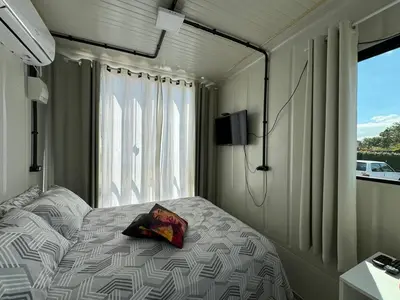 Uma cama ou camas num quarto em Charmoso e bem localizado!