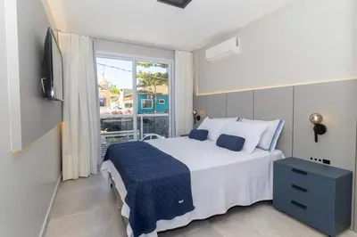 Uma cama ou camas num quarto em Solar do Atlântico 102 – Beira Mar em Bombas