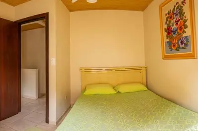 Uma cama ou camas num quarto em Casa 100m da praia, 10 pessoas, 3 quartos ,,