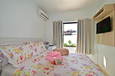 Uma cama ou camas num quarto em Pousada Enseada dos Golfinhos