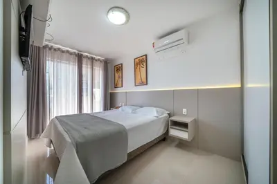 Uma cama ou camas num quarto em Apartamento 2 quartos sendo 1 suíte em Bombas