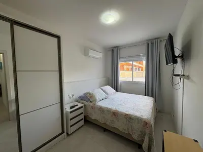 Uma cama ou camas num quarto em cód 144 - Apartamento aconchegante!