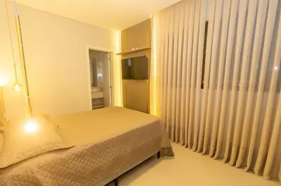 Uma cama ou camas num quarto em 107A - Apartamento a poucos metros do mar em Bombas