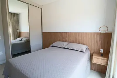 Uma cama ou camas num quarto em 115F - 3 quartos a 100m da Praia de Bombas