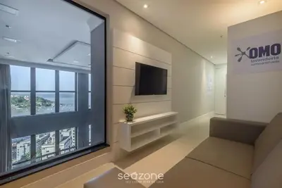 Uma televisão e/ou sistema de entretenimento em MHF II - Apts Variados em Prédio com Vista para o Mar em Itapema
