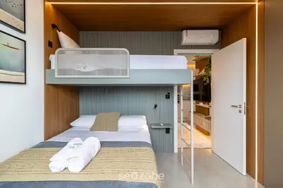 Uma cama ou camas num quarto em MHF II - Apts Variados em Prédio com Vista para o Mar em Itapema