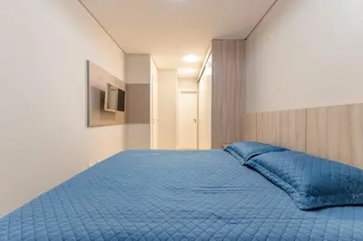 Uma cama ou camas num quarto em Condomínio com Piscina e Spa - Boulevard Bombinhas