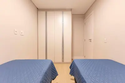 Uma cama ou camas num quarto em Localização Privilegiada Apartamento a 200m da Praia