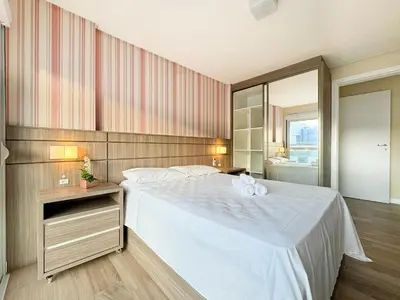 Uma cama ou camas num quarto em Amplo apartamento em Palmas - GCR002