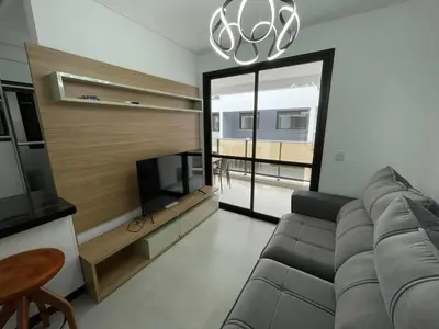 Uma televisão e/ou sistema de entretenimento em Cód 98 - Belissímo apartamento á 280m do mar