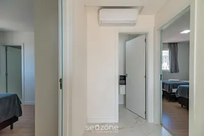 Uma cama ou camas num quarto em CII - Apartamentos a 900m da Praia em Porto Belo