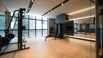 O centro de fitness e/ou as comodidades de fitness de Flat no Coração de Meia Praia em Itapema