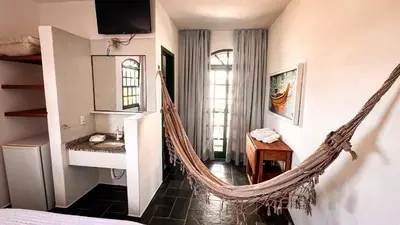 Uma cama ou camas num quarto em Pousada