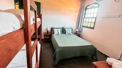 Uma cama ou camas num quarto em Pousada