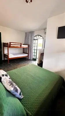 Uma cama ou camas num quarto em Pousada