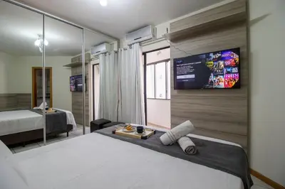 Uma cama ou camas num quarto em MDV93 - Quadra Mar, 3 Dorm, Garagem