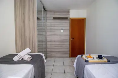 Uma cama ou camas num quarto em MDV93 - Quadra Mar, 3 Dorm, Garagem
